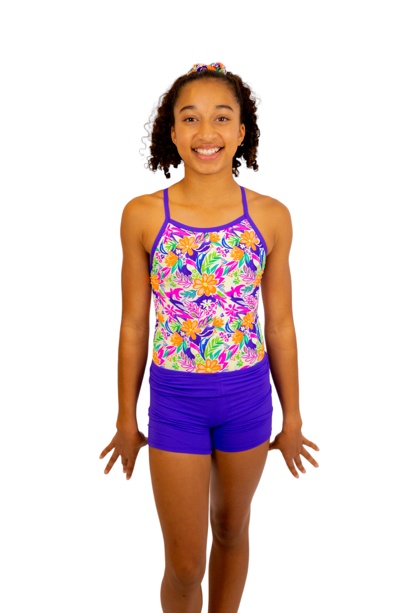 Bright Coloured Tropical Print One Piece Leotard or Swimsuit for Girls. Gymnastics Leotard, Girls Swimwear, Strappy Back, Racer Back, Tank Style, Thin Straps all Available. Fluorescent Purple, green, Yellow, Orange Flowers. Matching Scrunchie and Bike Shorts. B you Active, B you Leotards, B you Swimwear.