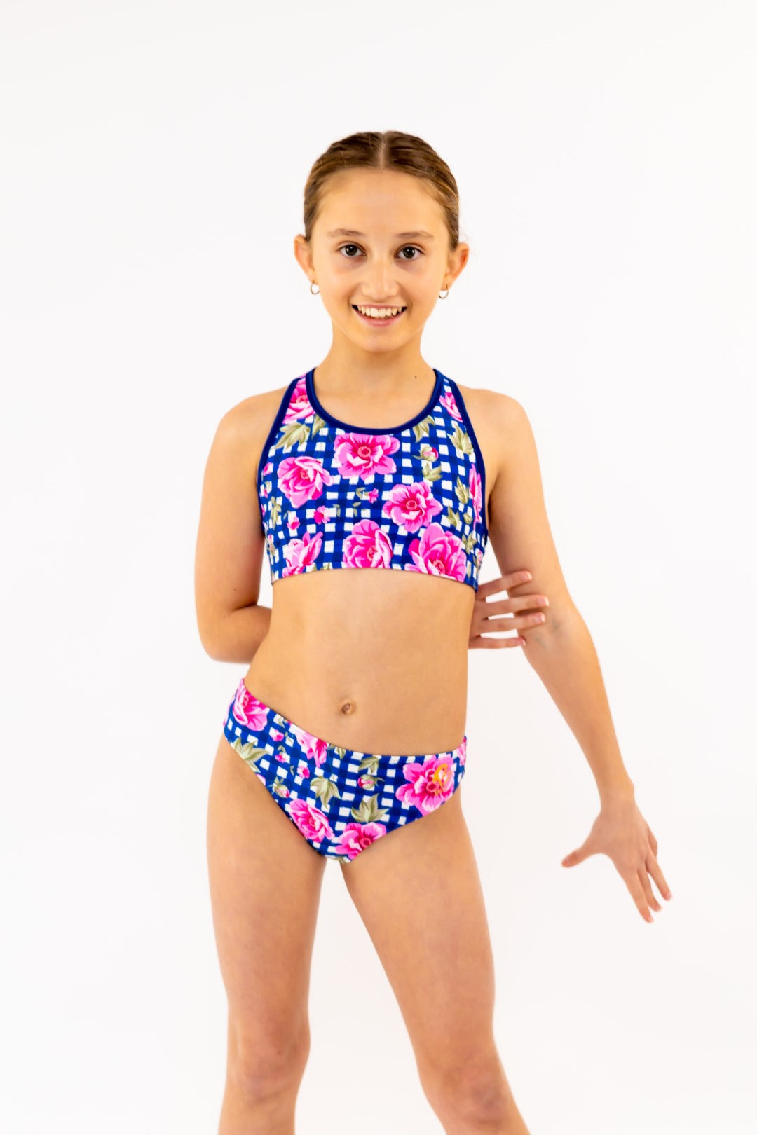 Navy Gingham Check Pink Flowers Bikini Bottoms for kids, Girls Swimwear with Gold Logo. Girls Activewear, Girls Gymnastics Wear, Kids Swimwear, Gymnastics Leotard, Dance Leotard, Crop top Set, Two Piece Set, Mix and Match Swimwear, Girls Bikinis, Gymnastics Australia, USA Gymnastics, Girls Leggings, Girls Tights, Girls Shorts. Coloured Bikini Bottoms. Swimsuit. Floral