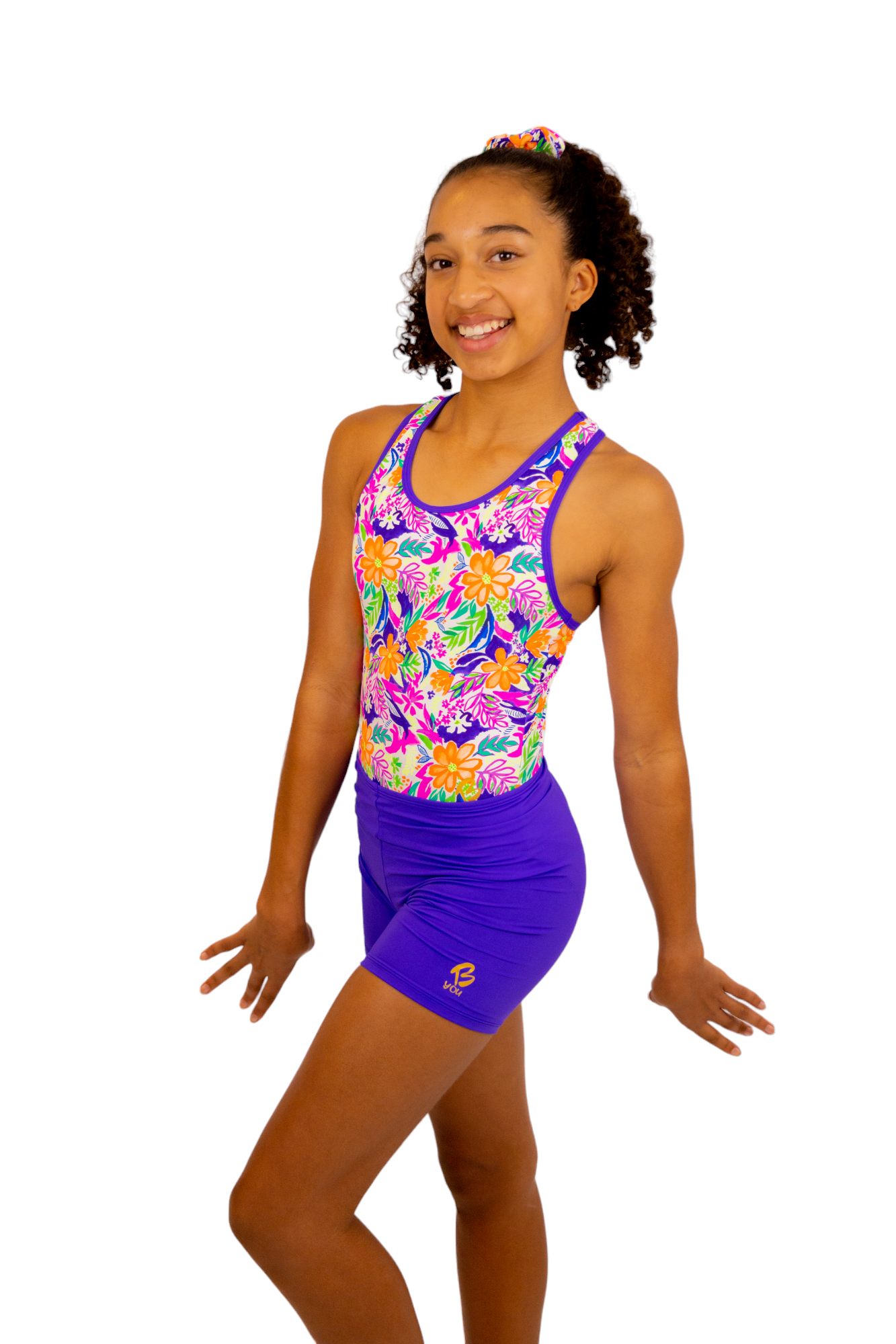 Bright Coloured Tropical Print One Piece Leotard or Swimsuit for Girls. Gymnastics Leotard, Girls Swimwear, Strappy Back, Racer Back, Tank Style, Thin Straps all Available. Fluorescent Purple, green, Yellow, Orange Flowers. Matching Scrunchie and Bike Shorts. B you Active, B you Leotards, B you Swimwear.