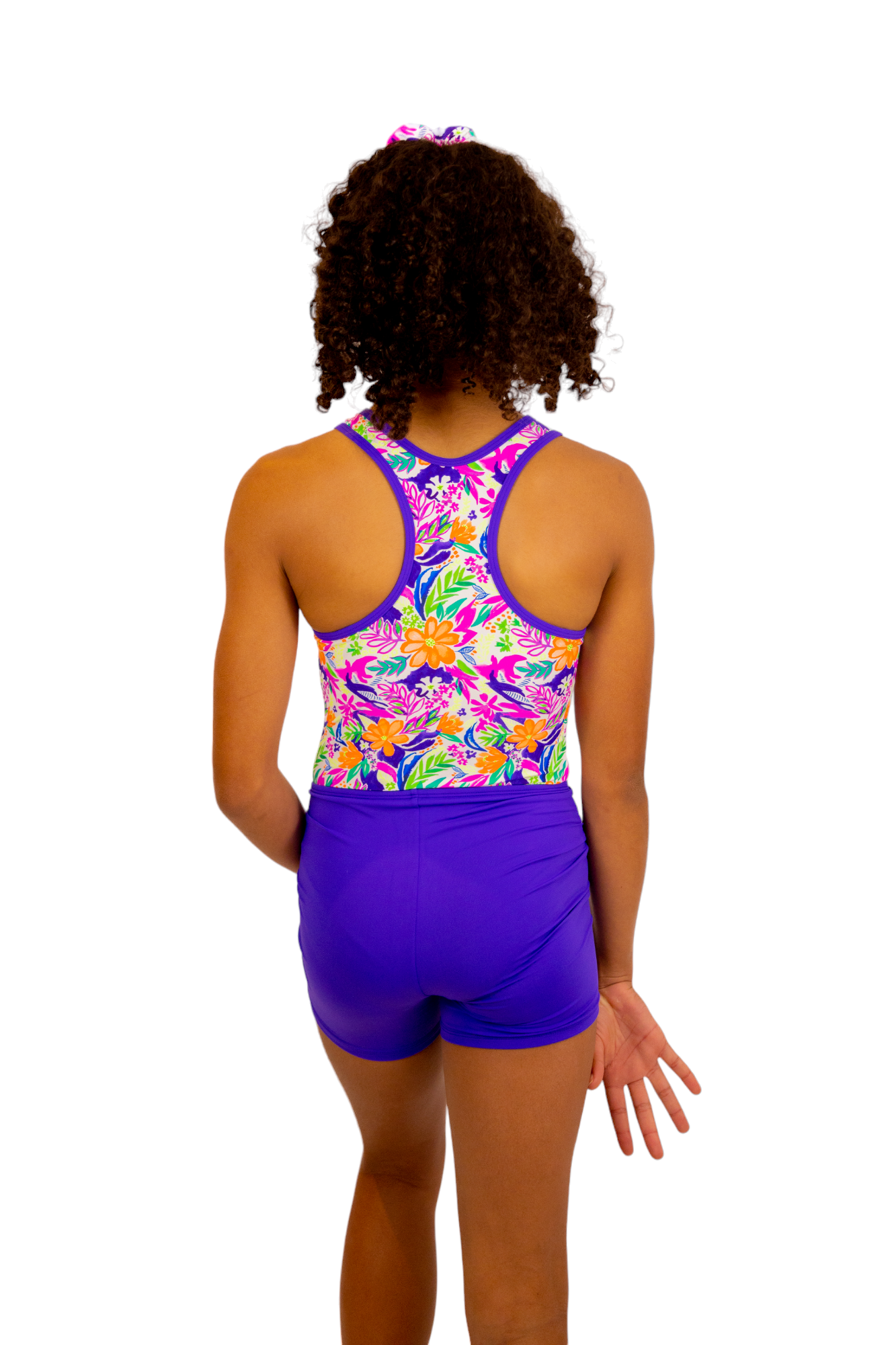 Bright Coloured Tropical Print One Piece Leotard or Swimsuit for Girls. Gymnastics Leotard, Girls Swimwear, Strappy Back, Racer Back, Tank Style, Thin Straps all Available. Fluorescent Purple, green, Yellow, Orange Flowers. Matching Scrunchie and Bike Shorts. B you Active, B you Leotards, B you Swimwear.