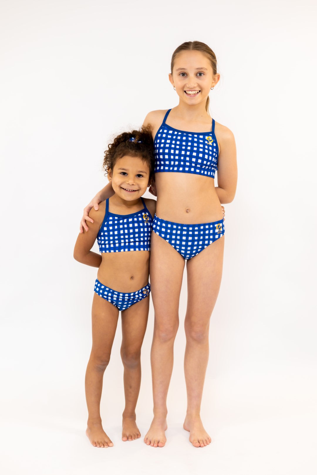 Navy Gingham Check Pink Flowers Bikini Bottoms for kids, Girls Swimwear with Gold Logo. Girls Activewear, Girls Gymnastics Wear, Kids Swimwear, Gymnastics Leotard, Dance Leotard, Crop top Set, Two Piece Set, Mix and Match Swimwear, Girls Bikinis, Gymnastics Australia, USA Gymnastics, Girls Leggings, Girls Tights, Girls Shorts. Coloured Bikini Bottoms. Swimsuit. Toddlers Swimwear