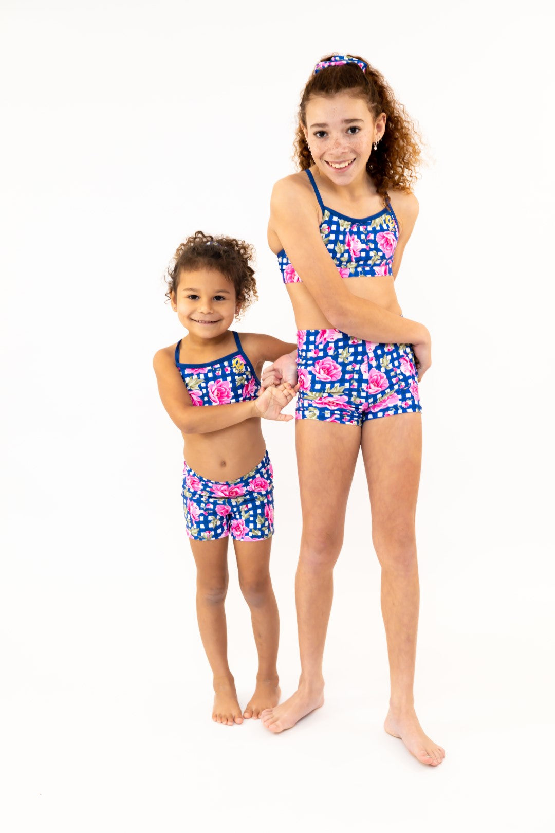 Navy Gingham Check Pink Flower Bike Shorts, Bike Pants with Gold Logo. Girls Activewear, Girls Gymnastics Wear, Girls Swimwear, Gymnastics Leotard, Dance Leotard, Booty Shorts, Crop top Set, Two Piece Set, Matching Leotard and Shorts, Bicycle Shorts, Gymnastics Australia, USA Gymnastics, Girls Leggings, Girls Tights, Girls Shorts. Coloured Bike Shorts. Gymnastics Shorts. Floral