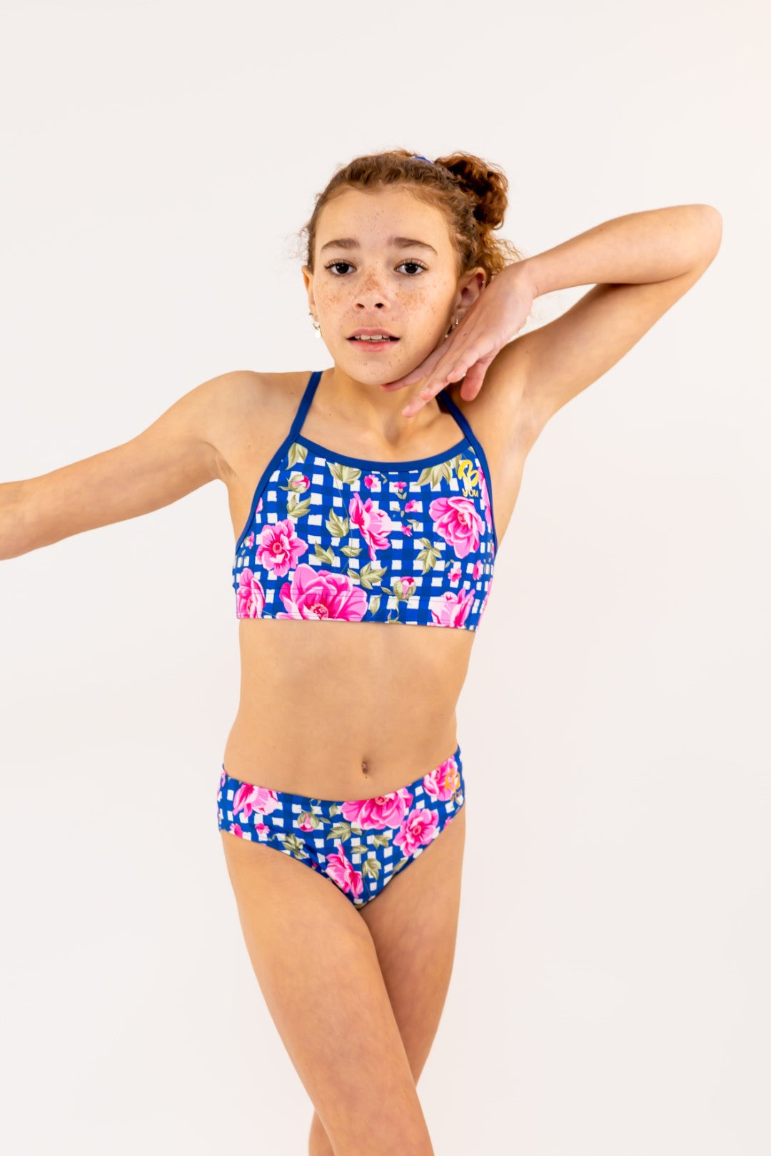 Navy Gingham Check Pink Flowers Bikini Bottoms for kids, Girls Swimwear with Gold Logo. Girls Activewear, Girls Gymnastics Wear, Kids Swimwear, Gymnastics Leotard, Dance Leotard, Crop top Set, Two Piece Set, Mix and Match Swimwear, Girls Bikinis, Gymnastics Australia, USA Gymnastics, Girls Leggings, Girls Tights, Girls Shorts. Coloured Bikini Bottoms. Swimsuit. Floral