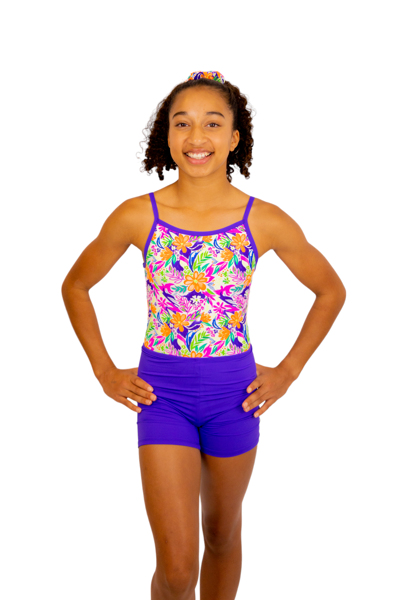 Bright Coloured Tropical Print One Piece Leotard or Swimsuit for Girls. Gymnastics Leotard, Girls Swimwear, Strappy Back, Racer Back, Tank Style, Thin Straps all Available. Fluorescent Purple, green, Yellow, Orange Flowers. Matching Scrunchie and Bike Shorts. B you Active, B you Leotards, B you Swimwear.