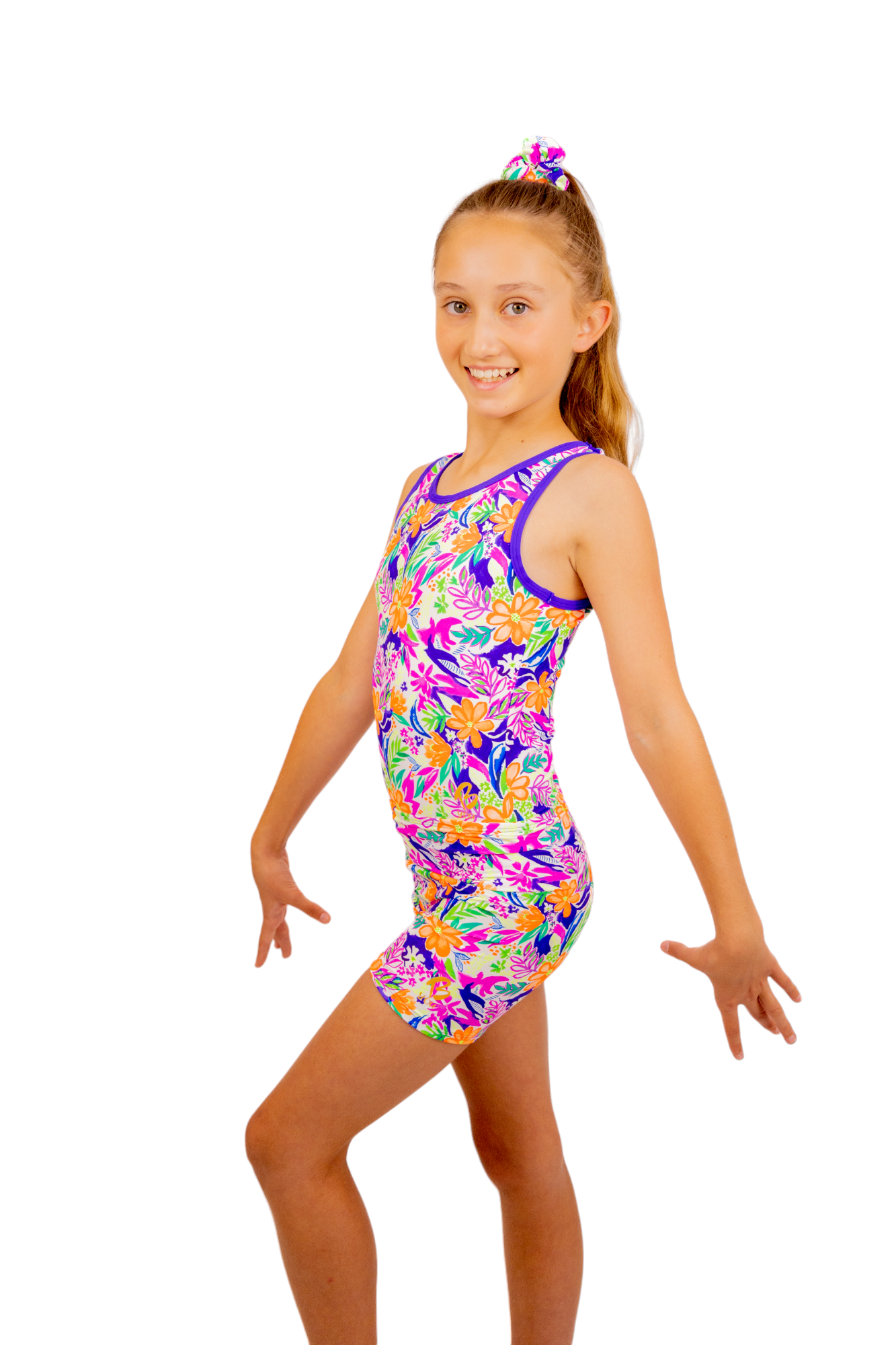 Tropical print Bike Pants or Bike Shorts. Fluorescent flowers, purple, orange, green. Gymnastics leotards, Two Piece Set, Crop Top set, Dancewear, Sports Bra, Gym Shorts, Booty Shorts. Activewear for Girls, Swimwear for Girls. B you Active, B you Leotards, B you Swimwear.