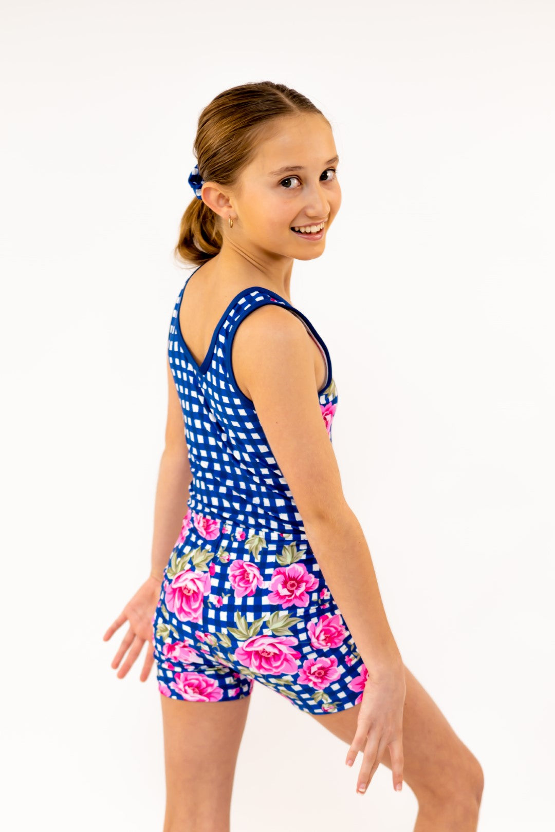 Navy Gingham Check Pink Flower Bike Shorts, Bike Pants with Gold Logo. Girls Activewear, Girls Gymnastics Wear, Girls Swimwear, Gymnastics Leotard, Dance Leotard, Booty Shorts, Crop top Set, Two Piece Set, Matching Leotard and Shorts, Bicycle Shorts, Gymnastics Australia, USA Gymnastics, Girls Leggings, Girls Tights, Girls Shorts. Coloured Bike Shorts. Gymnastics Shorts. Floral