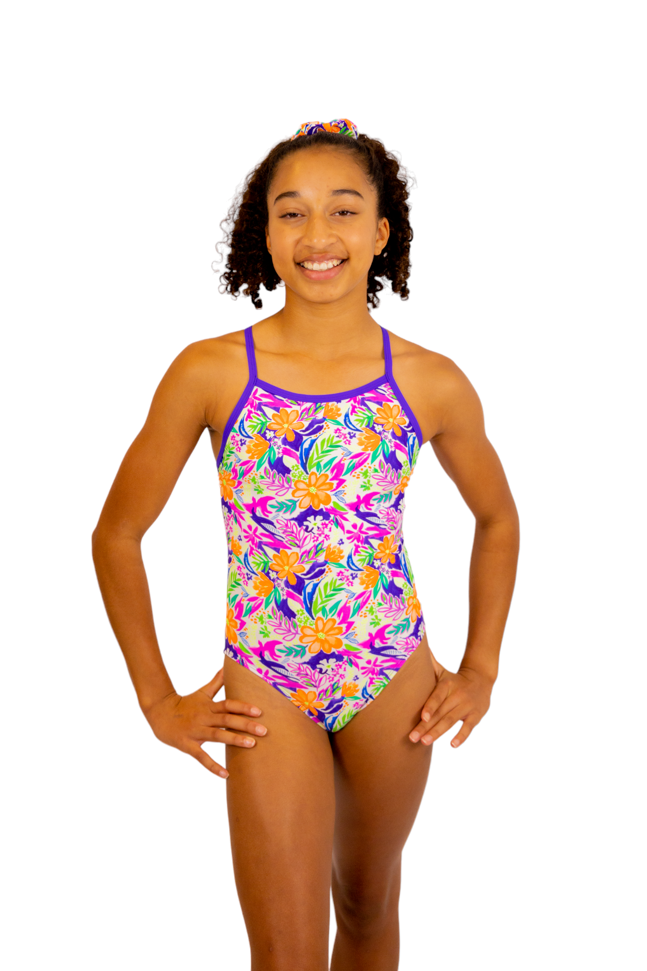 Bright Coloured Tropical Print One Piece Leotard or Swimsuit for Girls. Gymnastics Leotard, Girls Swimwear, Strappy Back, Racer Back, Tank Style, Thin Straps all Available. Fluorescent Purple, green, Yellow, Orange Flowers. Matching Scrunchie and Bike Shorts. B you Active, B you Leotards, B you Swimwear.