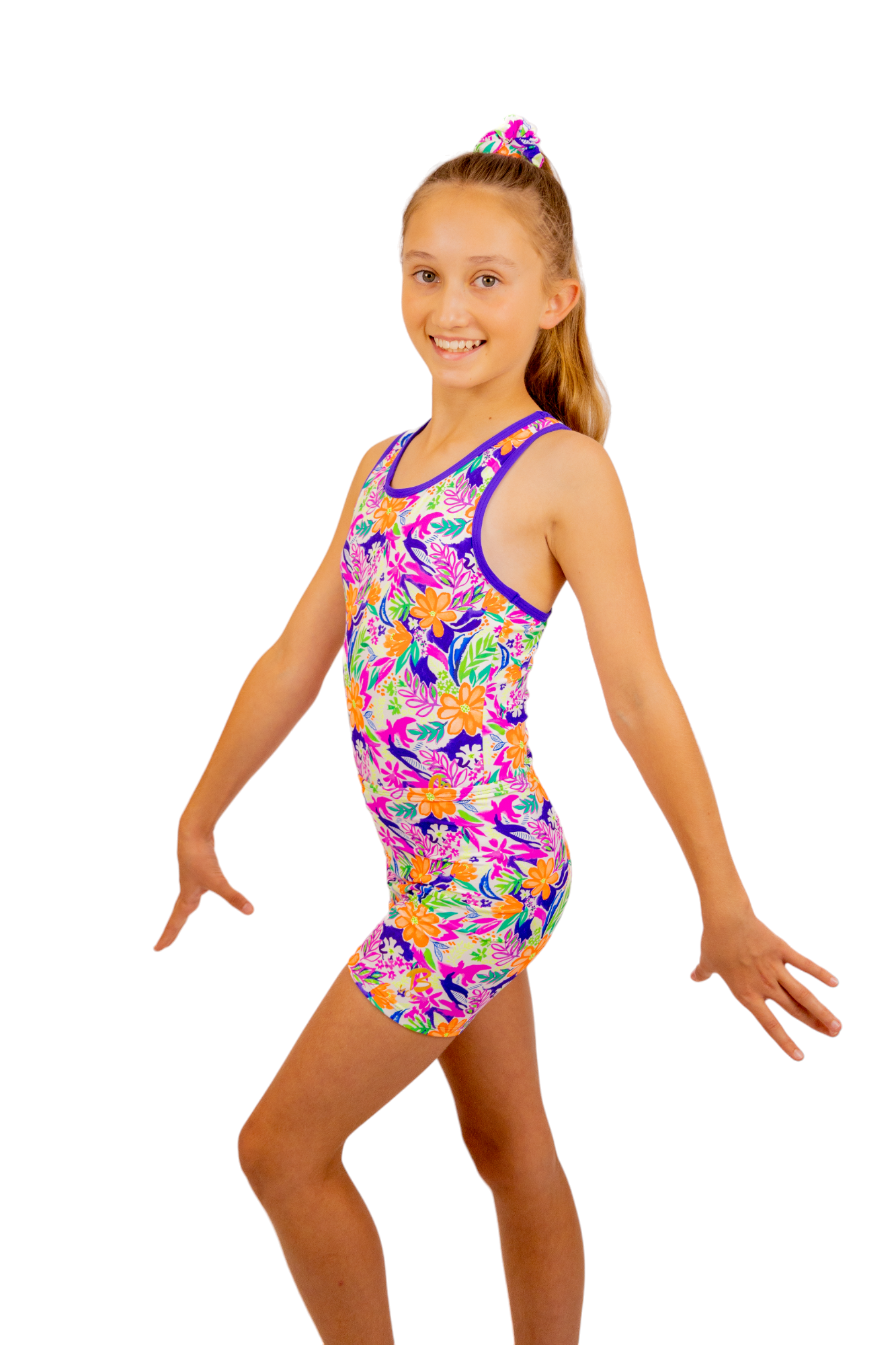 Tropical print Bike Pants or Bike Shorts. Fluorescent flowers, purple, orange, green. Gymnastics leotards, Two Piece Set, Crop Top set, Dancewear, Sports Bra, Gym Shorts, Booty Shorts. Activewear for Girls, Swimwear for Girls. B you Active, B you Leotards, B you Swimwear.