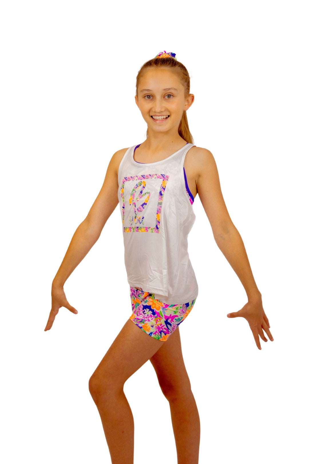 Tropical print Bike Pants or Bike Shorts. Fluorescent flowers, purple, orange, green. Gymnastics leotards, Two Piece Set, Crop Top set, Dancewear, Sports Bra, Gym Shorts, Booty Shorts. Activewear for Girls, Swimwear for Girls. B you Active, B you Leotards, B you Swimwear.