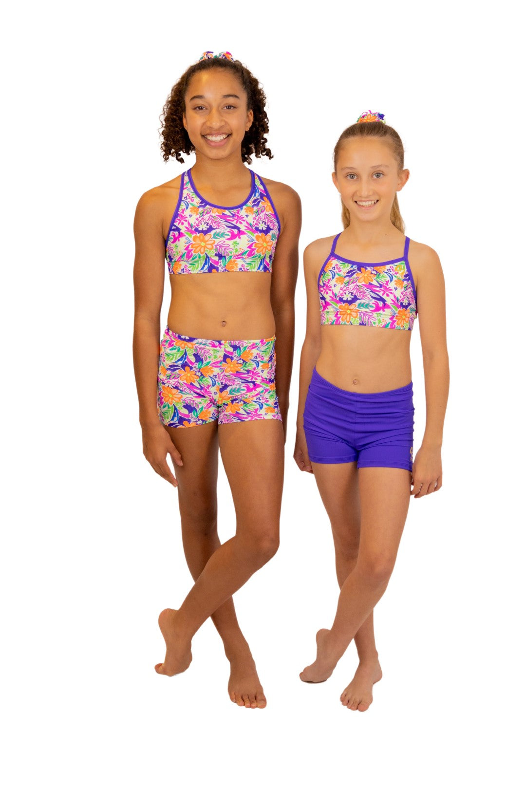 Tropical print Bike Pants or Bike Shorts. Fluorescent flowers, purple, orange, green. Gymnastics leotards, Two Piece Set, Crop Top set, Dancewear, Sports Bra, Gym Shorts, Booty Shorts. Activewear for Girls, Swimwear for Girls. B you Active, B you Leotards, B you Swimwear.