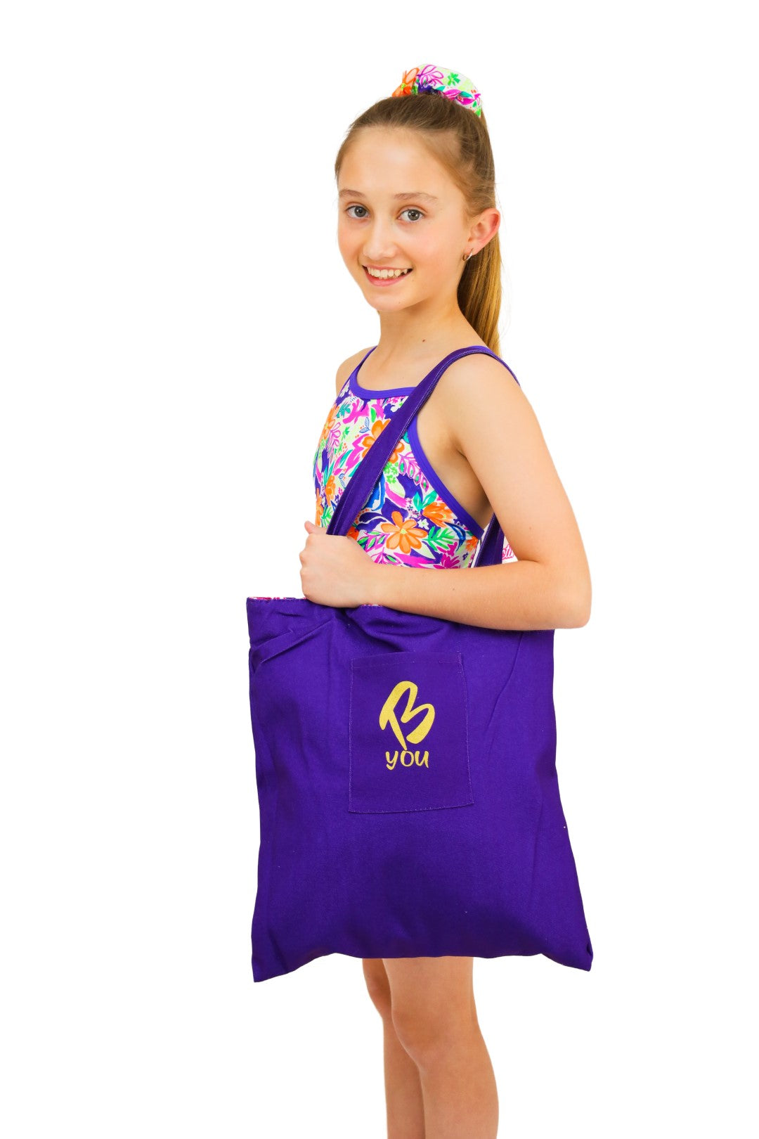 Purple and Tropical Canvas Tote Bag. Reversible. Features Green, Purple and Orange Tropical Print. Perfect for Active and Sporty Girls. B you Active, B you Leotards, B you Swimwear for girls. Activewear for kids. Gymnastics and Dancewear. Leotards and Sports.