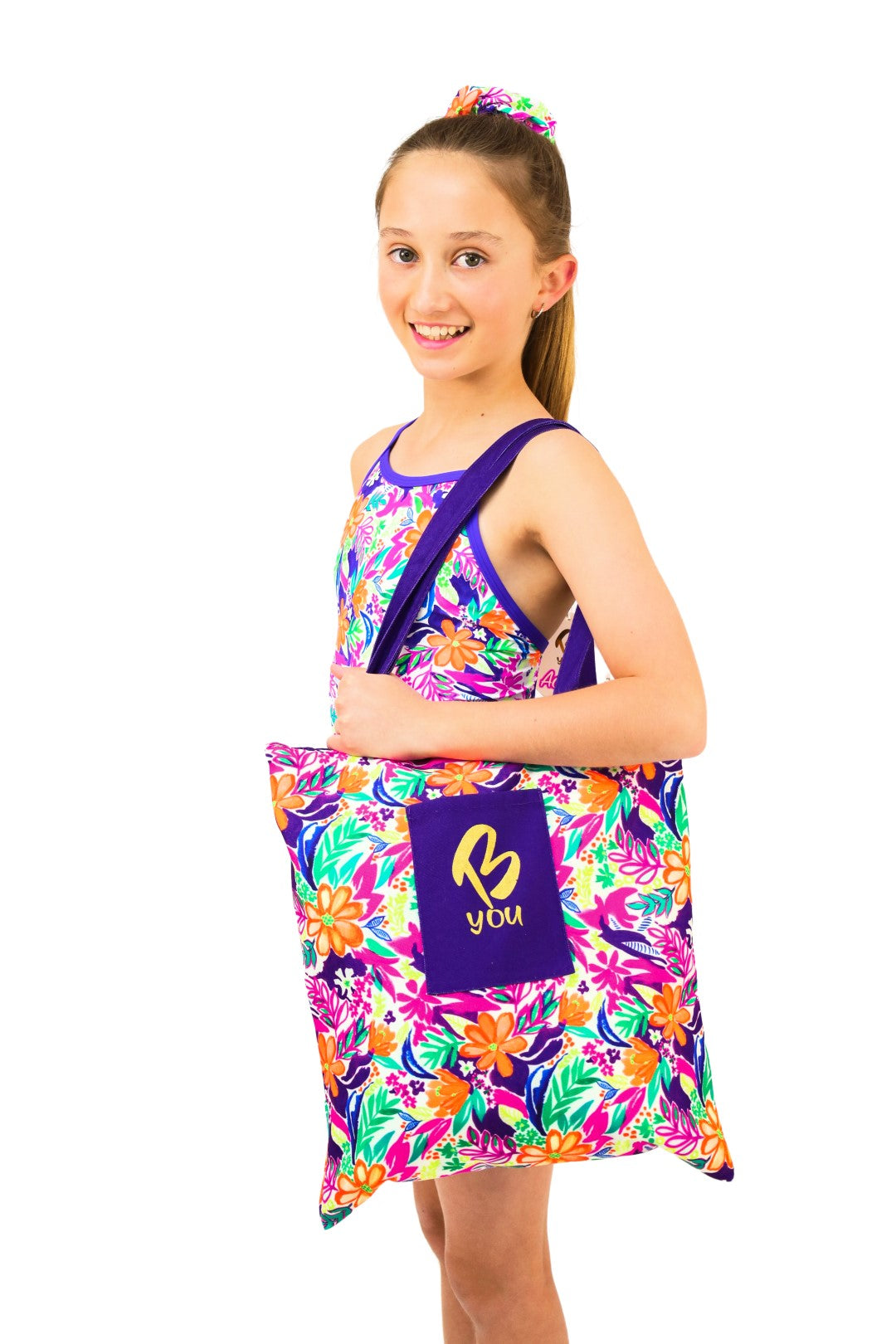 Tropical and Purple Canvas Tote Bag. Reversible. Features Green, Purple and Orange Tropical Print. Perfect for Active and Sporty Girls. B you Active, B you Leotards, B you Swimwear for girls. Activewear for kids. Gymnastics and Dancewear. Leotards and Sports.